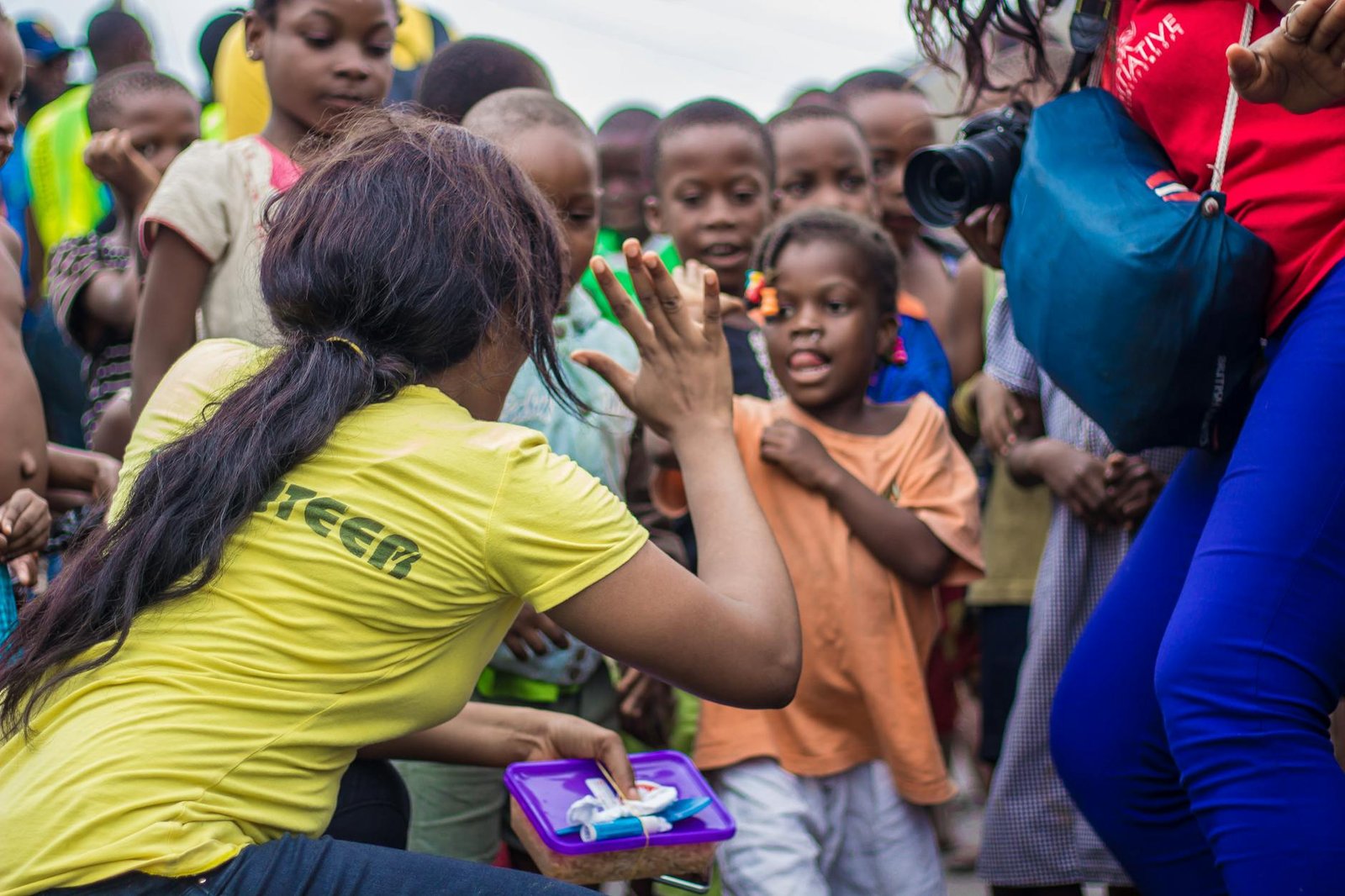 Volunteer engaging with children